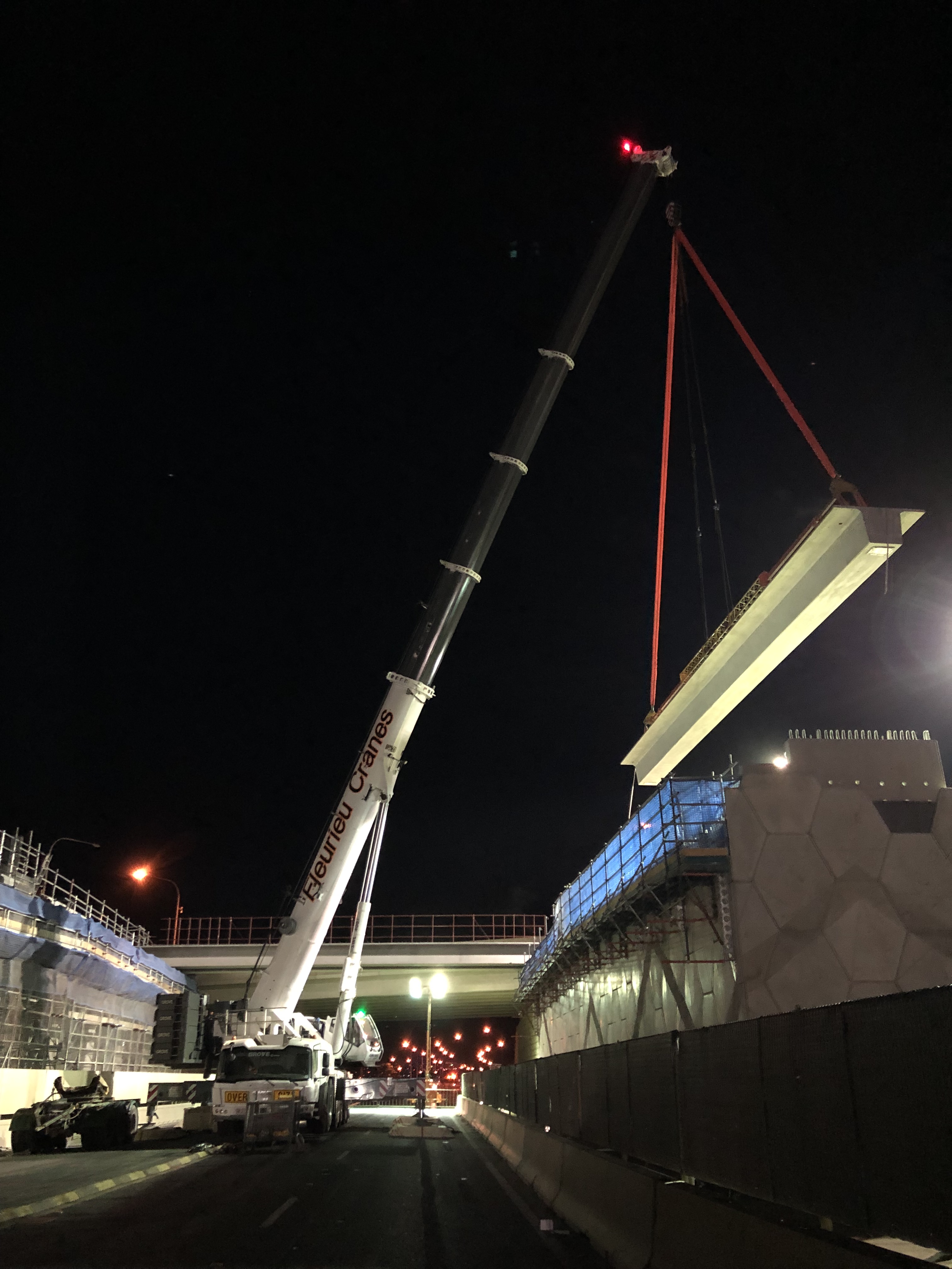 installing concrete beams for the new bridge across the Port River Expressway as part of Southern Interchange construction works - January 2019